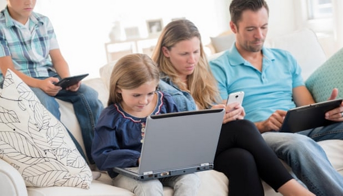 Limit your own screen time, parents are urged