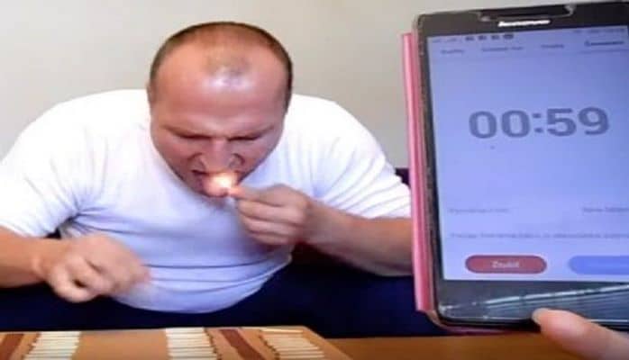 Dilində 62 kibrit söndürüb rekord qırdı